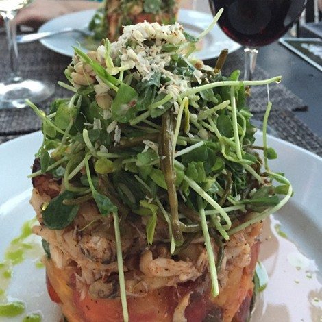 Dungeness Crab with Peach Salsa, Sprouted Pea Greens, Sea Vegetables topped with Shaved Hazelnut and Gruyere C ST Bistro Jacksonville Oregon